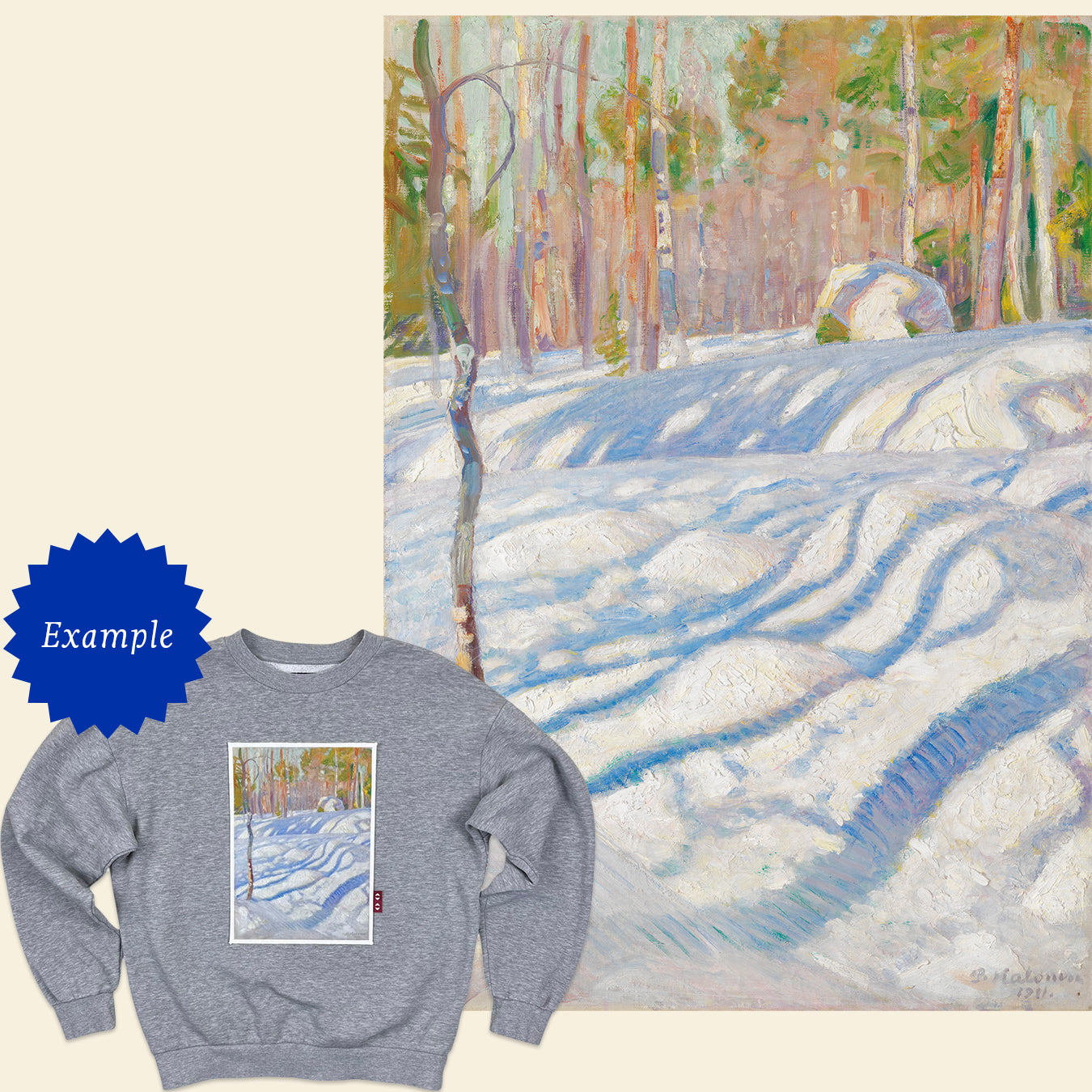 Sweatshirt with a forest design next to a painting of a snowy forest